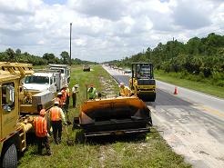 Patch 5. Crew working on patching road.