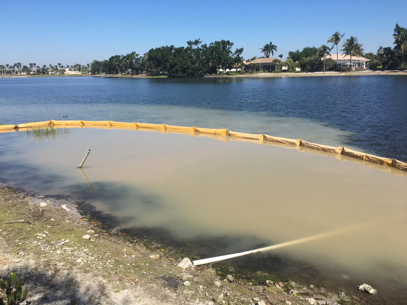 Turbid waterbody with containment boom