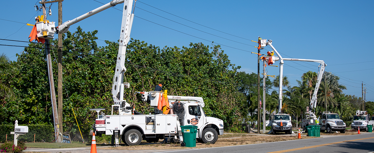 Photo of Utility Trucks working on powerlines