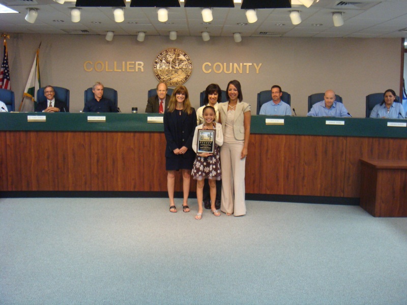 Estates Elementary School representative receiving award for naming preserve